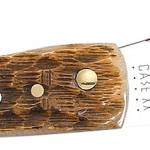 Case 00245 Sod Buster Jr. Plain Peach Seed Jigged Amber Bone Handle